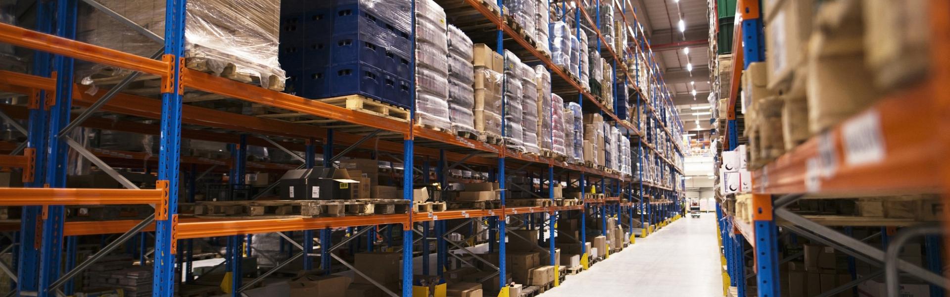 interior large distribution warehouse with shelves stacked with palettes goods ready market