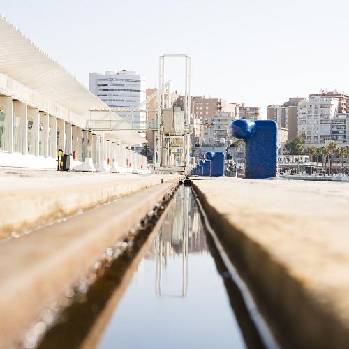 diminishing perspective water canal near dock