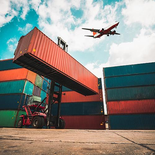 cargo container overseas shipping shipyard with airplane sky